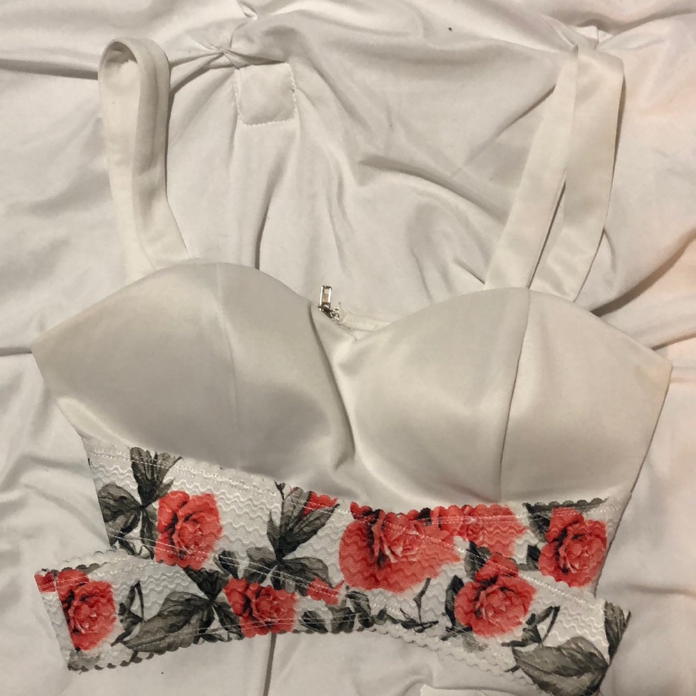 White and floral top. Zips in back